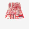Naomi smockad bomullsvoile-kjol med bandana-tryck Naomi smockad bomullsvoile-kjol med bandana-tryck